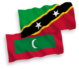 Flags of Federation of Saint Christopher and Nevis and Maldives on a white background