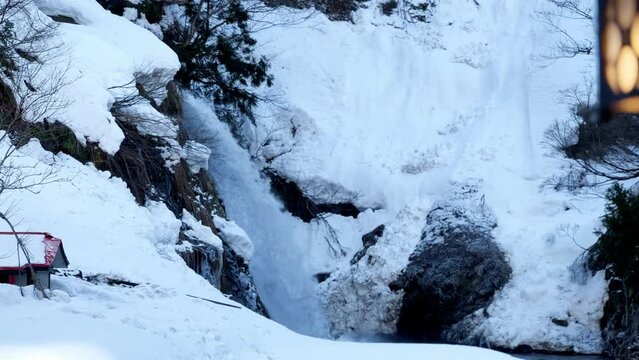 Revealing a Waterfall in Snow, Ginzan Onsen,h Japan, Pan shot