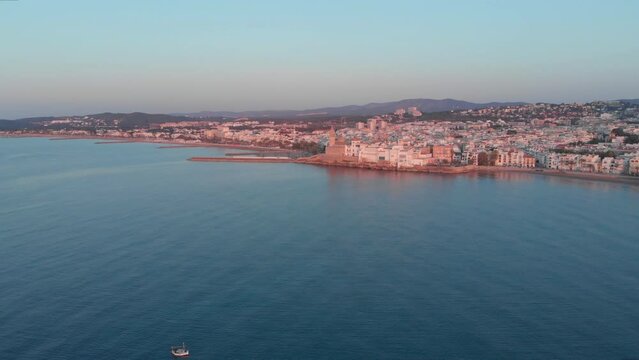 Aerial sunset drone view of coastline Sitges Spain, travel background