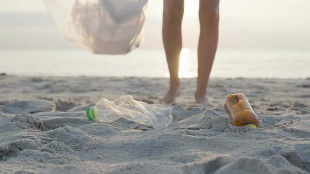 Save water. Volunteer pick up trash garbage at the beach and plastic bottles are difficult decompose prevent harm aquatic life. Earth, Environment, Greening planet, reduce global warming, Save world