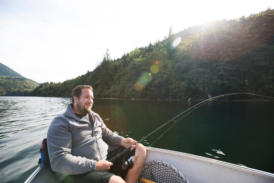 Man fishing in Hicks Lake, Harrison Hot Springs, British Columbia, Canada