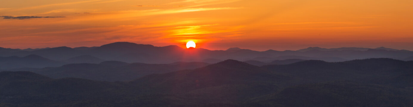 Panoramic view from Buck Mountain summit at sunset with Gore Mountain visible, Adirondack Mountains, New York State, USA