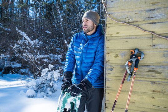 Man resting after snowshoeing