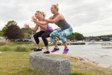 Two women jumping