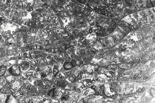 Close-up of plastic lump of polymer resin injection molding process