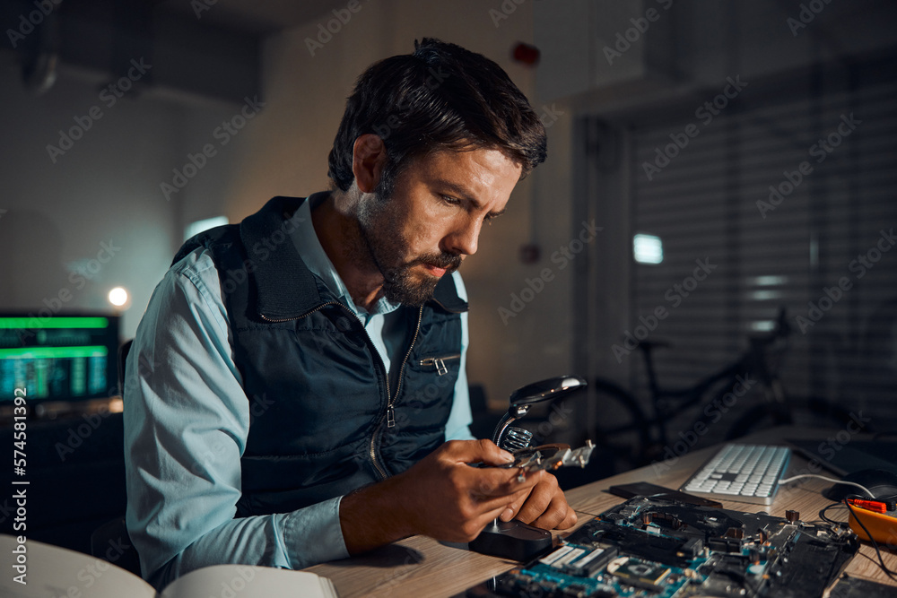 Poster man, circuit and it repair workshop in night for maintenance, computer tech or industry with focus. 
