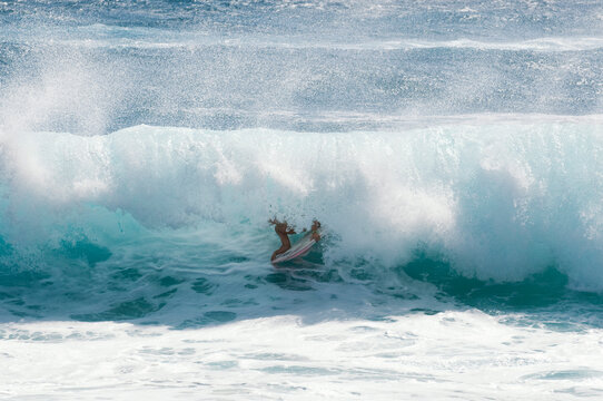A man gets barreled in brutal shore break of Sandy Beach, Oahu, Hawaii.
