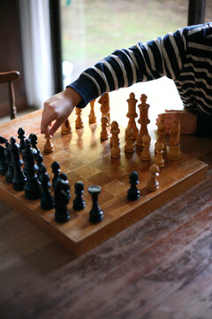 Child playing chess, Vancouver, British Columbia, Canada