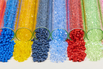several colored plastic resins in test tubes in laboratory
