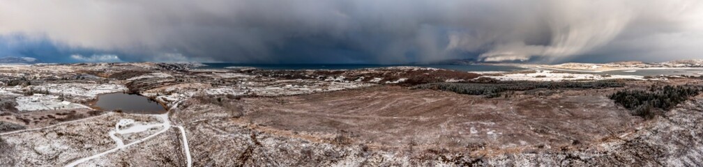 Aerial view of snow covered Bonny Glen Woods by Portnoo in County Donegal, Ireland.