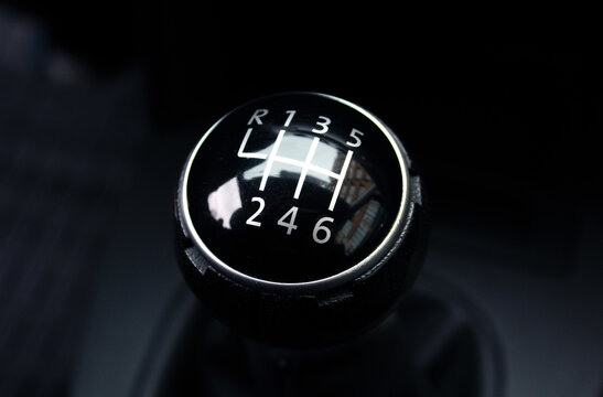 The handle of switching of transfers in the car. Car gear. Power engine gear. A manual shift car gear lever.