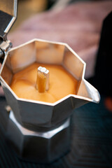 close up coffee creama in espresso boild pot