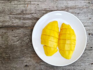 Mango tropical fruit on wood background