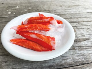 Crab sticks on wood background
