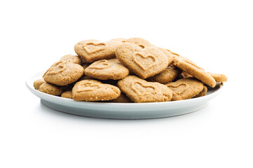 Sweet gingerbread hearts on plate isolated on white background.