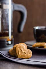 Sweet gingerbread hearts on table.