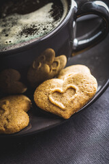 Sweet gingerbread hearts and coffee cup.