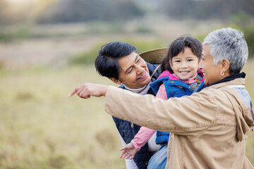 Farm, agriculture and parents with girl in countryside for holiday, vacation and adventure on grass field. Farming, family adoption and happy child with lesbian couple for quality time on ranch