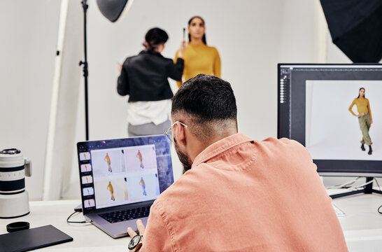 Laptop, photography editor and model in studio with photographer and shooting fashion design magazine cover or content. Creative, tech or startup people in collaboration, teamwork or makeup backstage