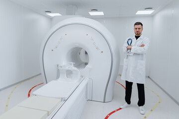 Fototapeta na wymiar A professional radiologist doctor stands next to an MRI machine in a specially equipped room in the clinic.
