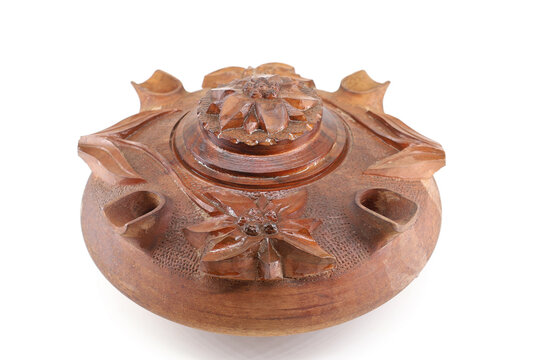 Grolla or Coupe de l'amiti&eacute; on white background. It is a handmade cup with lid and spouts, used to drink coffee and brandy. Traditional tool of the Alps regions between France and Italy