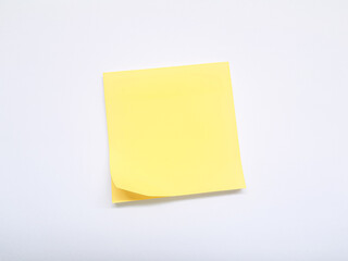 Isolated shot of blank yellow sticky note on white background