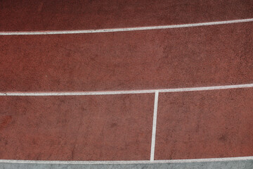Fototapeta premium Bright red artificial running track