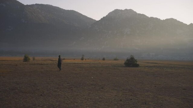Slow motion shot of a man walking through the valley in the Ibradi Akseki mountain range