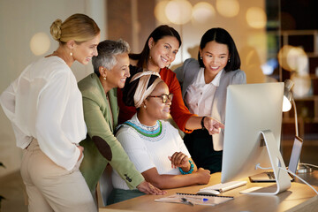 Computer, management and a business woman with her team, working on a deal in the office at night. Collaboration, diversity and coaching with a senior female manager training her staff at work