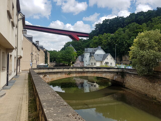 Fototapeta premium Old and modern bridges, houses, trees and river in Luxembourg City