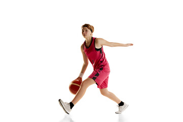 Fototapeta Dribbling. Teen girl, basketball player in motion, playing, training isolated over white studio background. Concept of sportive lifestyle, active hobby, health, endurance, competition obraz