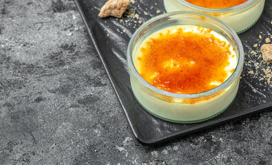 homemade creme brulee with burnt sugar. traditional french vanilla cream dessert. place for text, top view