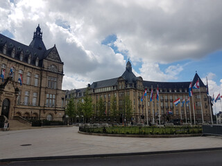 Beautiful old buildings, square and flags in Luxembourg City