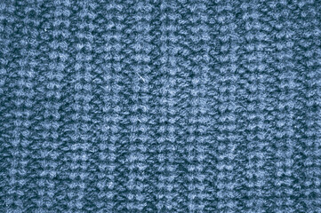 Handmade knitted material with macro woven threads.