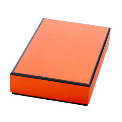 Cardboard gift box of bright orange color with dark edging along the contour of the lid, closed, lies diagonally across the shot, isolated on a white background. Full sharpness.