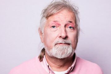 portrait of a senior man with face makeup