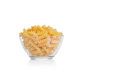 Pasta products in the form of a spiral on a plate, texture, on a white background