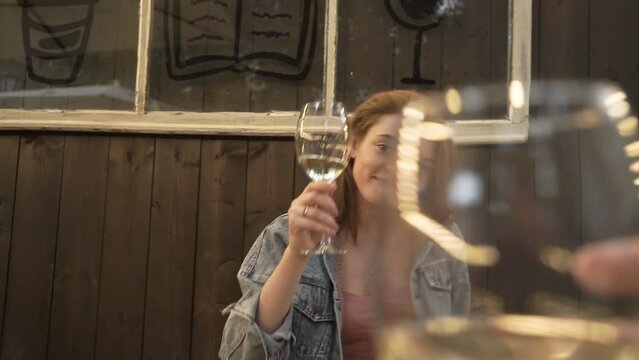 a girl is cheered by a glass of white wine