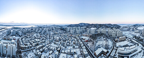 a Panorama picture of cold winter city in snow.. Republic of Korea