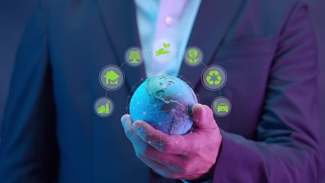 Businessman holding global network connection with icons in co2 environmental concept. Clean energy, renewable energy, Net Zero, Love the world, sustainable energy and reducing global warming.