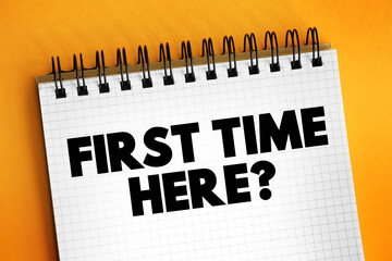 First Time Here? text on notepad, concept background