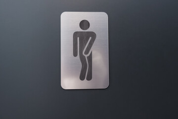 man wc icon sign on the dark door