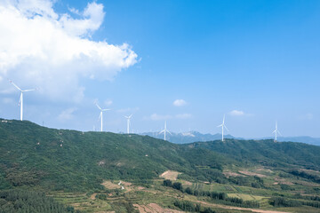 Wind power generation windmills lined up on the mountain. Aerial view.