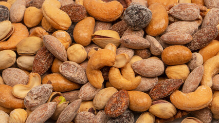 A group of almonds, pistachios, walnuts, macadamia, cashews.