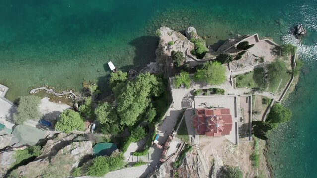 Aerial view of Ohrid with Kaneo beach and church. UNESCO protected heritage - Macedonian Orthodox Church of St. John the Evangelist, located on a cliff above the Kaneo beach