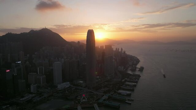 Sunset Behind International Finance Center Building Hong Kong, Cinematic Wide Angle Establishing Drone Shot