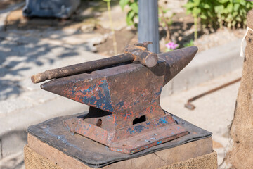 An old iron anvil for forging metal in a smithy or forge,old iron tool