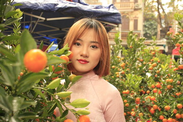 beautiful young Vietnamese girl enjoy Tet holiday 