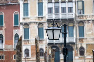 Fototapeta na wymiar Old wall street lighting, in the old town, Venice, Italy