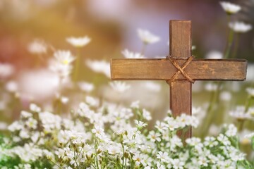Wooden Cross in fresh spring flowers